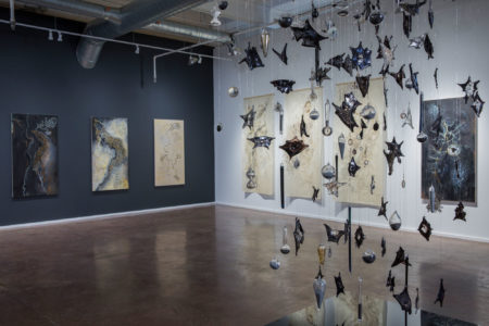 Alison Hildreth, installation view at SPEEDWELL projects, including "Flight," (front), glass bats, glass elements, carborundum, assorted elements, 4’ x 6’ x 12', as configured 2018.