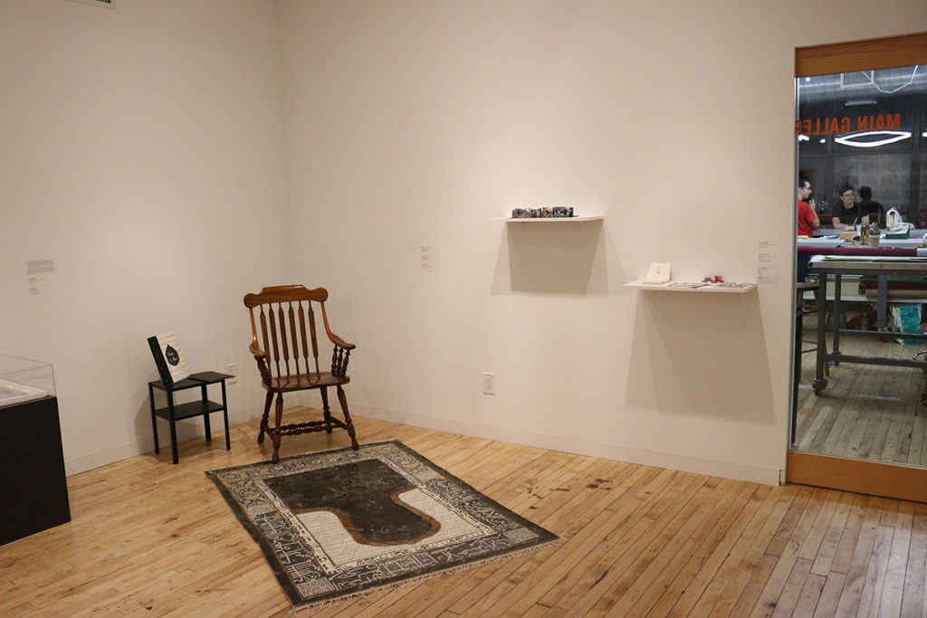 Poetry is Not a Luxury installation shot, including Joyce Dallal, Family Album, Rug, on left. Center for Book Arts, New York.